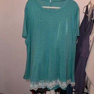 Top purchased from Amazon. Lace hem detail. Size 28W.